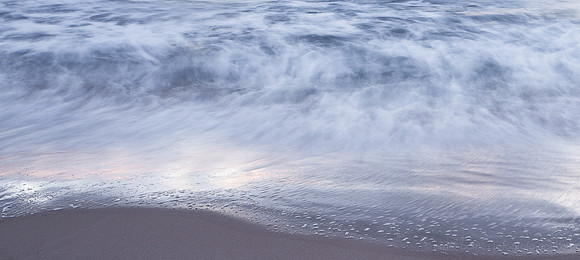 sunset and twilight beach scene, waves, sand, water