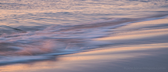 sunset and twilight beach scene, waves, sand, water