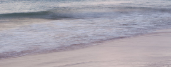 sunset and twilight beach scene, waves, sand, water