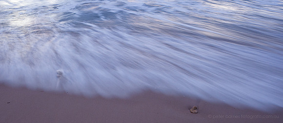 sunset and twilight beach scene, waves, sand, water